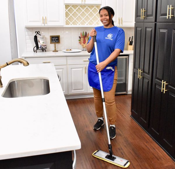 woman cleaning a kitchen